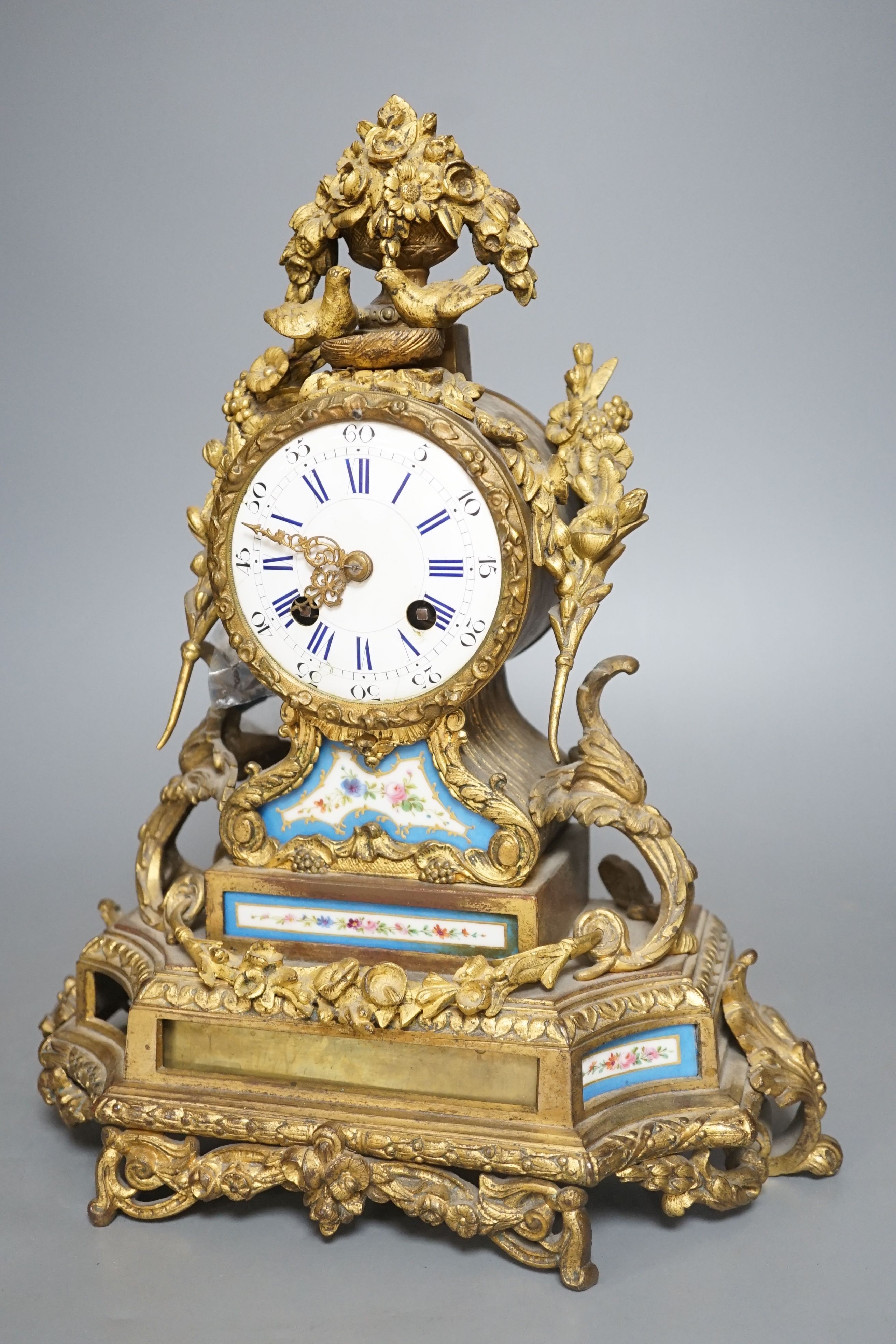 A 19th century French Sevres style porcelain and ormolu mantel clock - 35cm tall